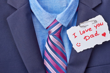 Necktie and Father's Day card. Tuxedo and inscription on paper. Elegant present for daddy.