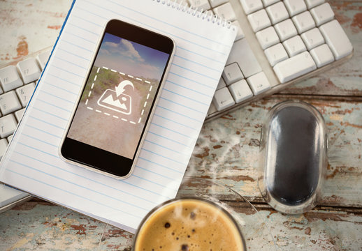 Smartphone on Desk with Notebook Mockup