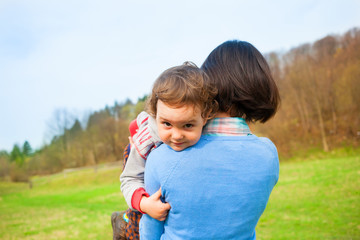 Fototapeta premium Mother holding her child in her arms.