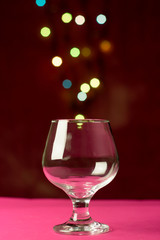 Wine glass with a light heart shaped bokeh in the background