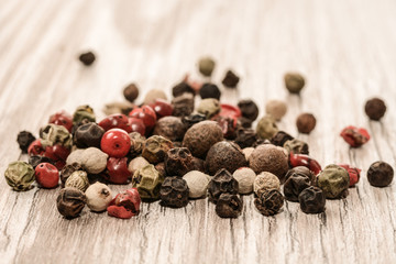 Set of whole peppercorns, handful of red, black, white peppercorns. Herbs and spices concept