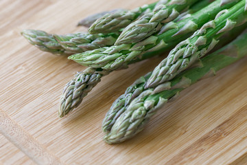 Orgarnic fresh asparagus  wooden block