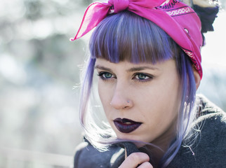 Alternative styled pensive girl portrait in morning light