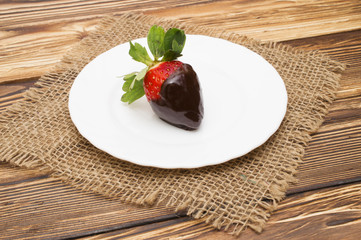 strawberry in chocolate over white background