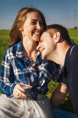 man and woman laughing on a picnic