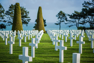 Fototapeta na wymiar White crosses in American Cemetery, Omaha Beach, Normandy, Franc