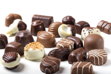 Assortment of fine chocolate candies over white