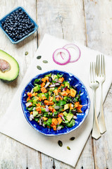 Roasted sweet potato black bean pepita avocado salad