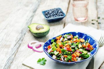 Roasted sweet potato black bean pepita avocado salad