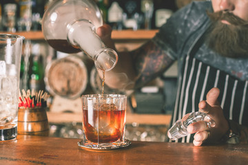 Barman is making cocktail