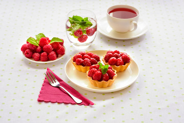 Tiny cupcakes with red berries