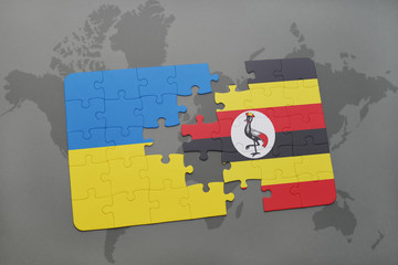 puzzle with the national flag of ukraine and uganda on a world map