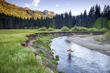 A man, Brendan Burnside, fly fishing in Pleasant Valley Creek in Markleeville, California.