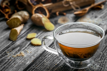 still life with transparent Cup of tea on wooden background