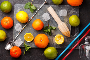 Fresh ripe citruses on a stone background.