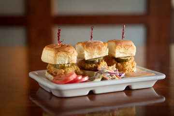 Chicken Sliders with Pickle and Secret Sauce and Tomato and Coleslaw on the side
