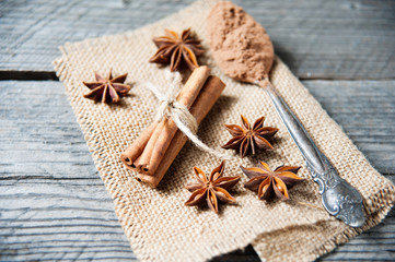 Cinnamon, cocoa, anise on wooden table