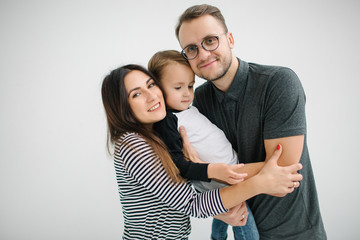 Hipster father, mother holding baby boy over white isolated back