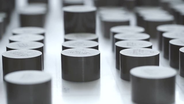 Factory. worker lays varistors on a special table