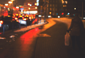 Night road in the city, cars light in traffic jams, defocused, v