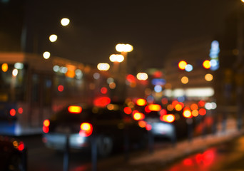 Night road in the city, cars light in traffic jams, defocused,
