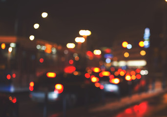 Night road in the city, cars light in traffic jams, defocused, v
