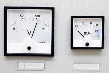 Two volt meter on the metal panel electrical shield.
