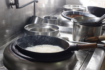 Close up of working chef preparing chinese food