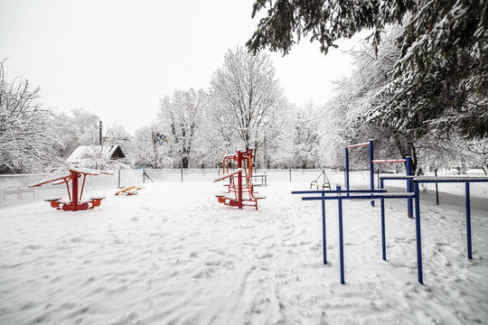 Outdoor workout gym with training gear in winter