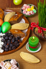 Colored eggs, wheat springs Nowruz Holiday in Azerbaijan. Selective focus.