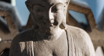 Buddha statue with cobweb