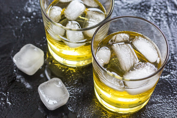 glass of whiskey on dark background