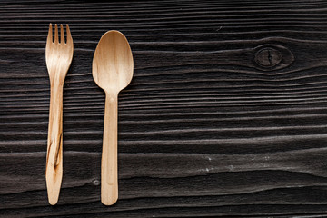 wooden kitchen utensils on dark background top view mock up