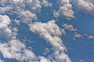 Naklejka na ściany i meble blue sky and cloudes from an airplane