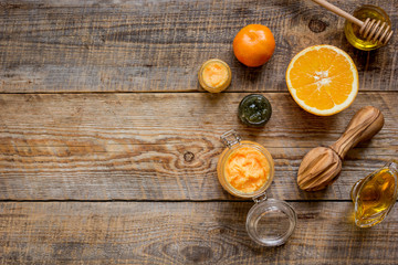 Fototapeta na wymiar organic citrus scrub homemade on wooden background top view
