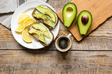 making sandwiches with avocado healthy organic food top view