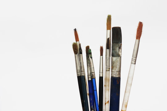 Set of different size paint brushes isolated on white