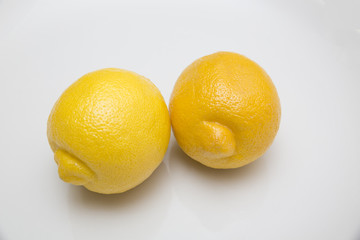 Fresh lemons on white background