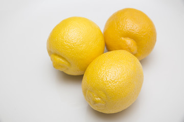 Fresh lemons on white background