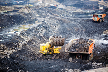 Mining dump trucks working in Lignite coalmine - obrazy, fototapety, plakaty