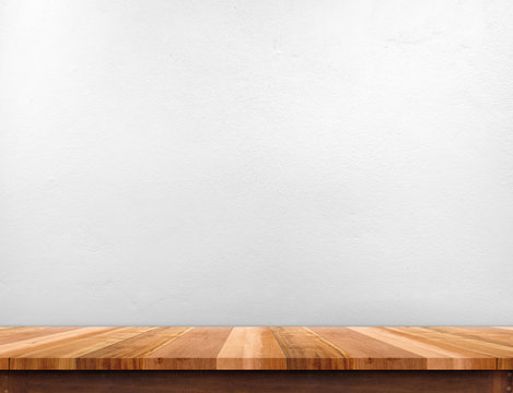 Wood brown plank table top with white paint concrete wall,Mock u