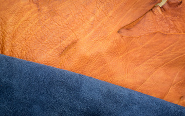 Close up orange rough edge and navy blue leather divide in two s