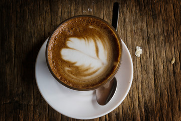 coffee cup on wooden table background
