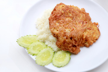 Omelet served with jasmine rice in white dish isolated on white background