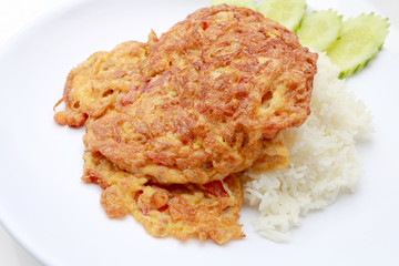 Omelet served with jasmine rice in white dish isolated on white background