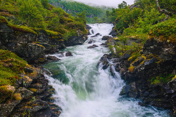 Naklejka na ściany i meble Landscape with views of the largest waterfall. The county of More og Romsdal. Norway