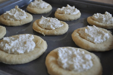 A closeup of a baking tray with cookie dough ready for baking