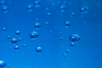 Abstract blur closeup water drops on blue background