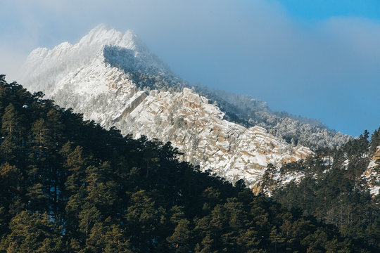 Stone rock in snow. In Kazakhstan Natonal park Burabay (Borovoe)