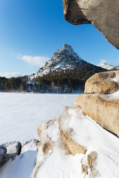 Stone rock in snow. In Kazakhstan Natonal park Burabay (Borovoe)